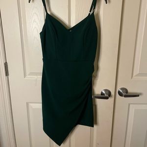 Emerald green mini dress with thigh slit.